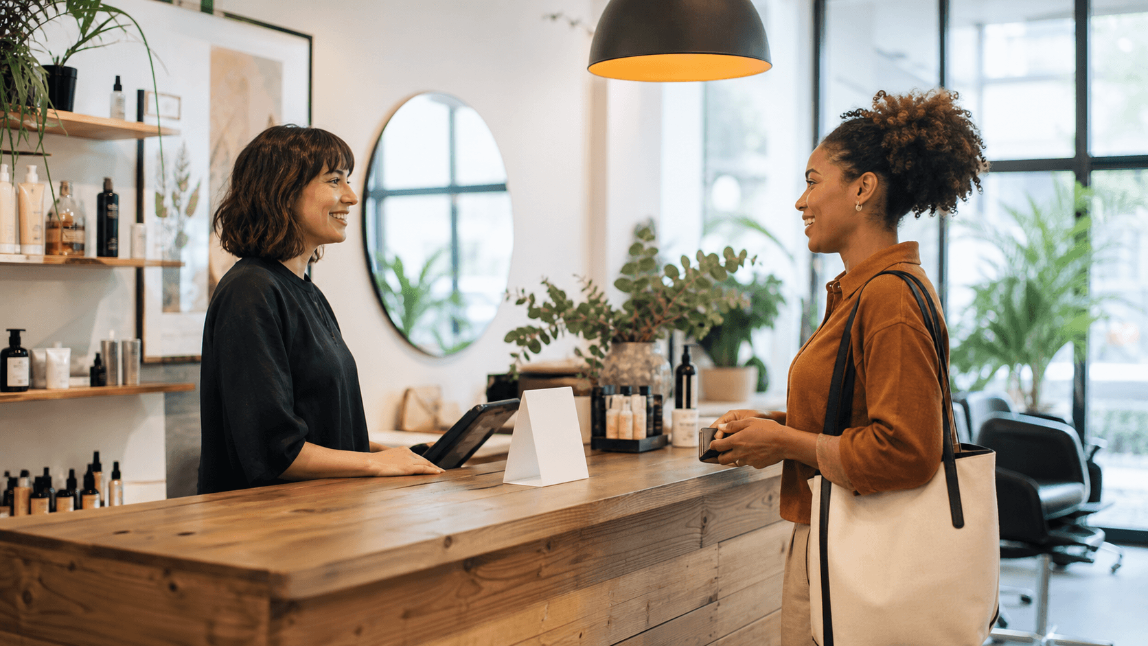 A local customer and business owner discuss feedback after a completed visit.